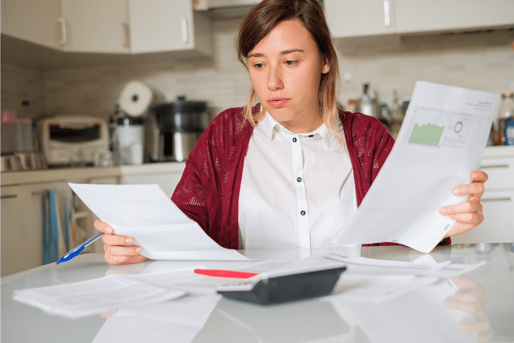 woman calculating debt to income ratio