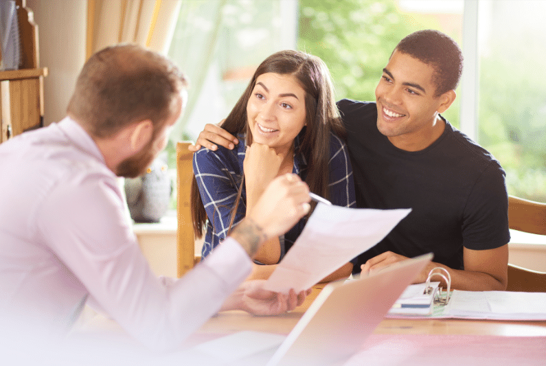 A family discussing their mortgage options with a lender