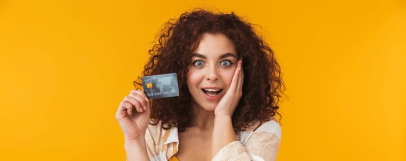 A person looking at a secured credit card